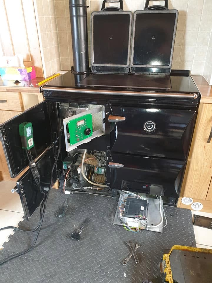 An oil-fired Stanley range cooker opened for servicing
